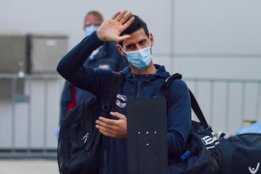 Serbian tennis player Novak Djokovic arrives before heading straight to quarantine for two weeks isolation ahead of their Australian Open warm up matches in Adelaide on January 14, 2021. / AFP / Brenton EDWARDS