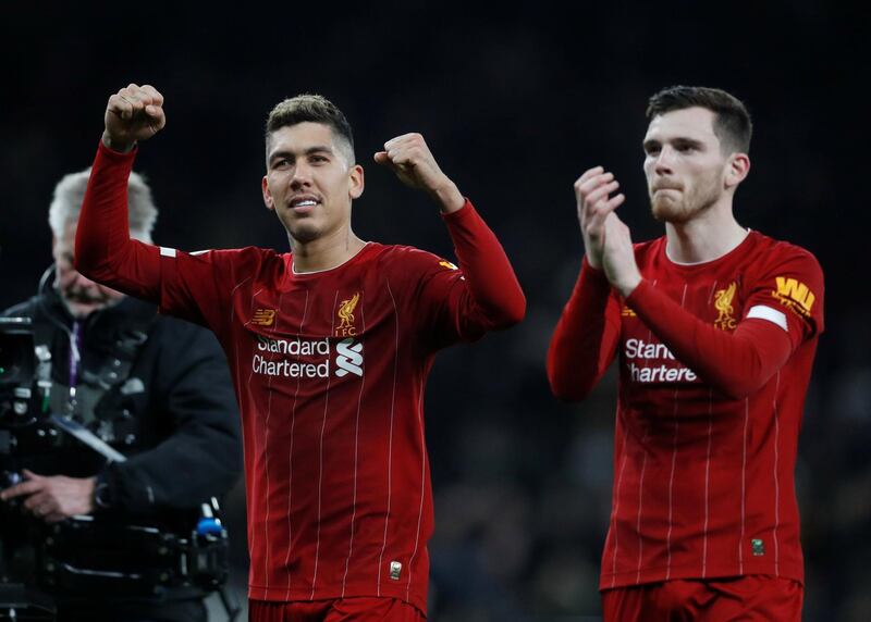 Liverpool's Roberto Firmino celebrates after the match with Andrew Robertson. Reuters