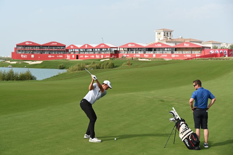 Josh Hill of England plays a shot on the 18th fairway. Getty Images