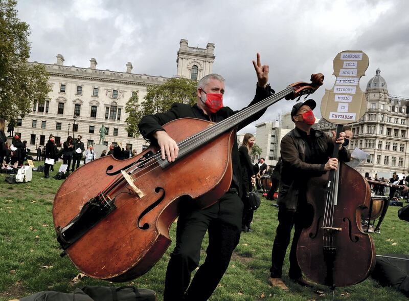 LONDON, ENGLAND - OCTOBER 06: Number of musicians perform while demonstrating at London's Parliament Square against recent COVID-19 restrictions in London, United Kingdom on October 06, 2020. (Photo by Hasan Esen/Anadolu Agency via Getty Images)