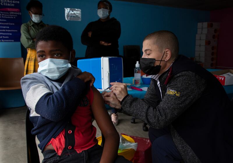 A boy receives a Covid-19 vaccination at a site near Johannesburg. The World Health Organisation's Africa director Matshidiso Moeti says the continent is moving into the ‘control phase’ of the pandemic. AP 