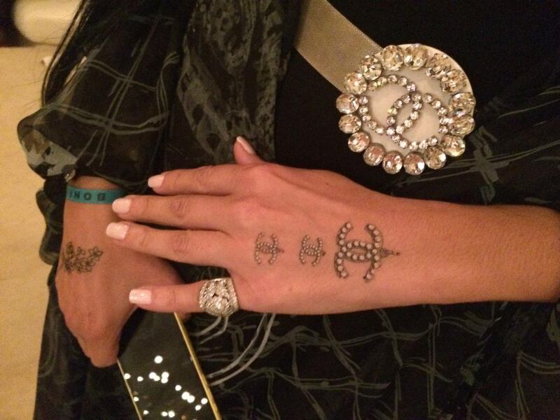 Temporary tattoos sported by a guest at Karl Lagerfeld’s Cruise collection 2014-15 on The Island in Dubai on May 13. Rebecca McLaughlin-Duane / The National