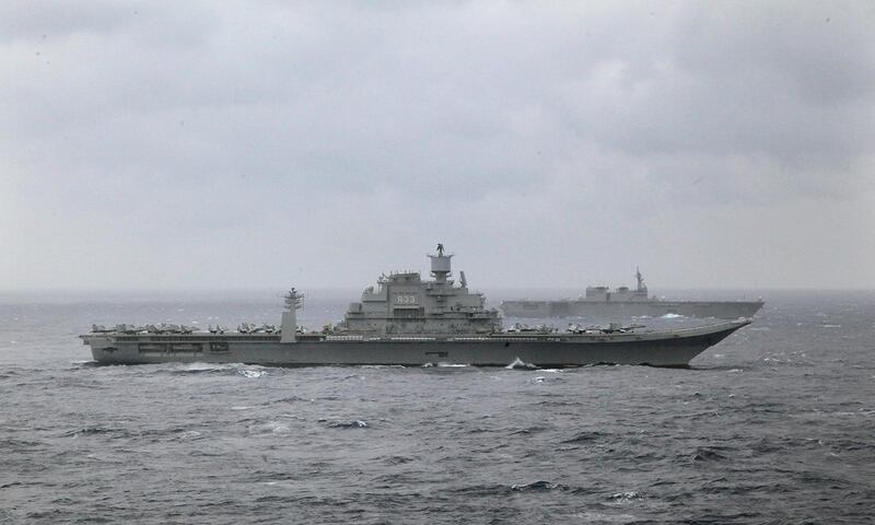 Indian naval ship INS Vikramaditya, foreground and Japan's helicopter carrier Izumo, behind participate in the Malabar 2017 tri-lateral exercises between India, Japan and US in the Bay of Bengal, Monday, July 17, 2017. (AP Photo/Rishi Lekhi)