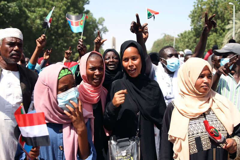Pro-military protesters hold a rally demanding the dissolution of Sudan’s government, outside the presidential palace. AP