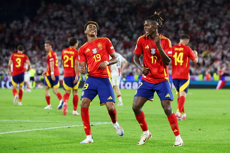Nico Williams of Spain celebrates scoring his team's third goal with teammate Lamine Yamal. Getty Images