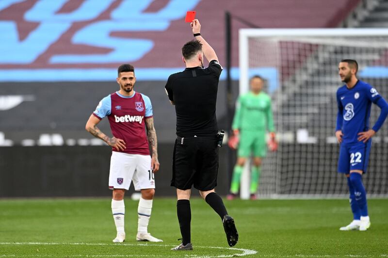 Fabian Balbuena of West Ham United is shown a red card by referee Chris Kavanagh. Getty