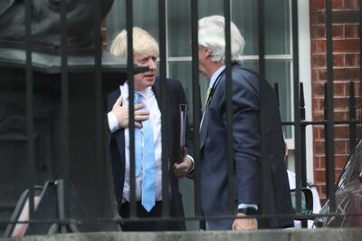 Lord Edward Udny-Lister speaking with Prime Minister Boris Johnson in Downing Street, London. Getty Images