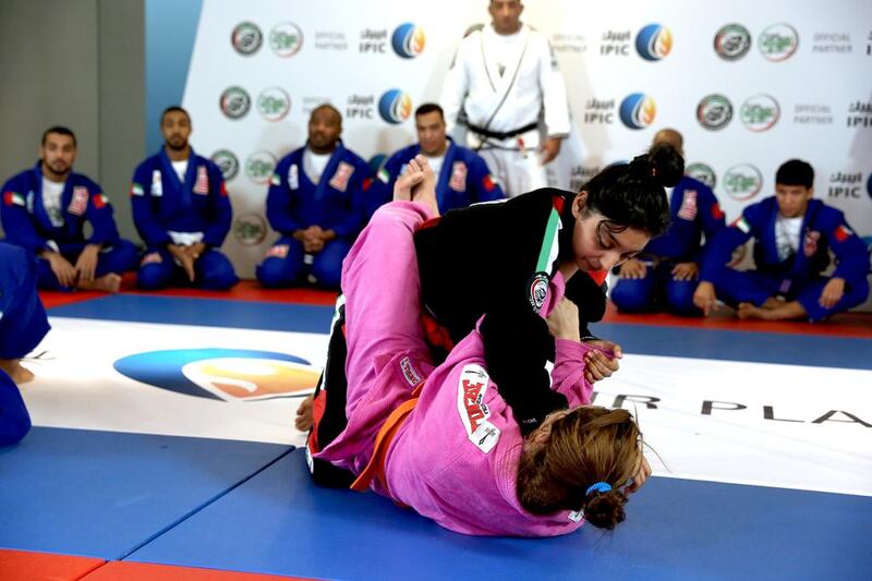 Alyazya Khalfan Al Shiary, 14, displays her skills during a demonstration of jiu-jitsu. She is confident of winning a gold medal in the orange belt 50.5-kilogramme division for girls in the Abu Dhabi World Junior Championship. Shahul Hameed / Al Ittihad