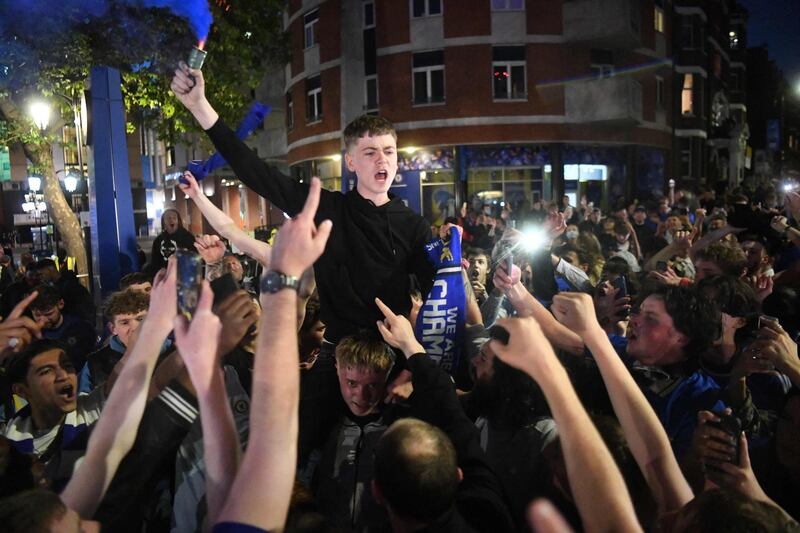 Chelsea supporters celebrate in streets surrounding their Stamford Bridge stadium in London their Champions League victory. AFP