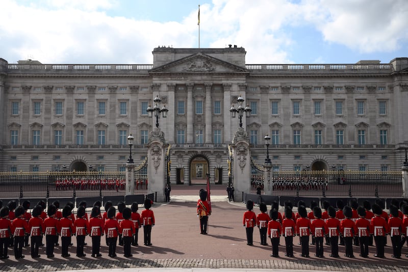 Coldstream Guards prepare outside Buckingham Palace, before the ceremonial procession. PA