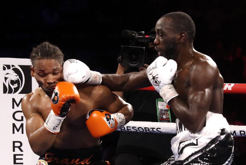WBO champion Terence Crawford punches Shawn Porter. AFP
