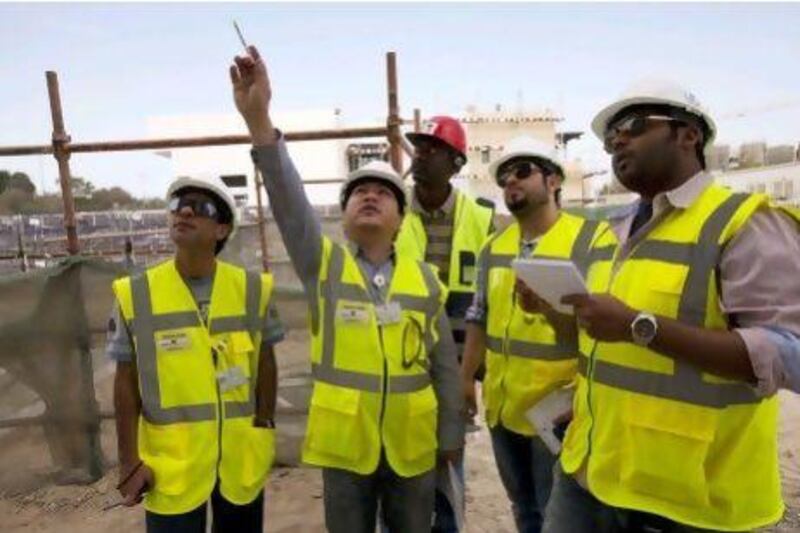 Health and safety inspectors visit a construction site in Abu Dhabi.
