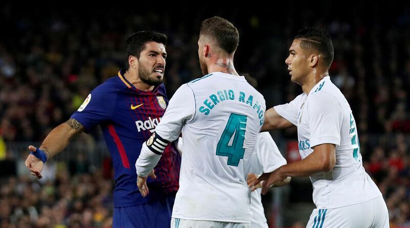 Barcelona's Luis Suarez clashes with Real Madrid's Sergio Ramos and Casemiro. Albert Gea / Reuters