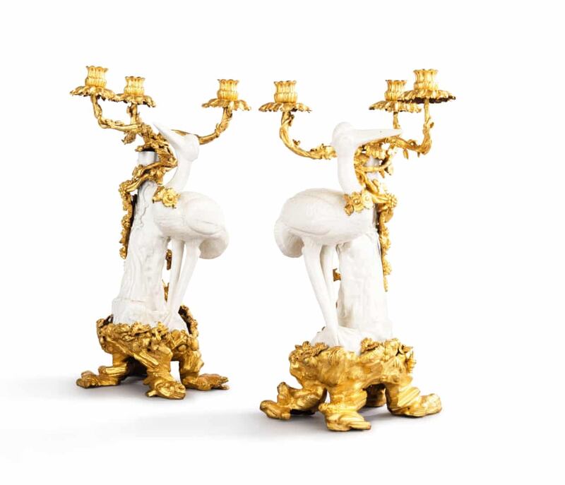 A pair of gilt-bronze-mounted blanc de Chine porcelain three-light a cigognes candelabras, commissioned by Louis XV, circa 1750, and once owned by Madame de Pompadour. Estimate: €200,000-€400,000.