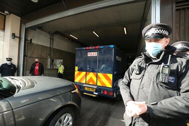A police van carrying Wayne Couzens arrives at Westminster Magistrates' Court, in London. (Steve Parsons/PA via AP)