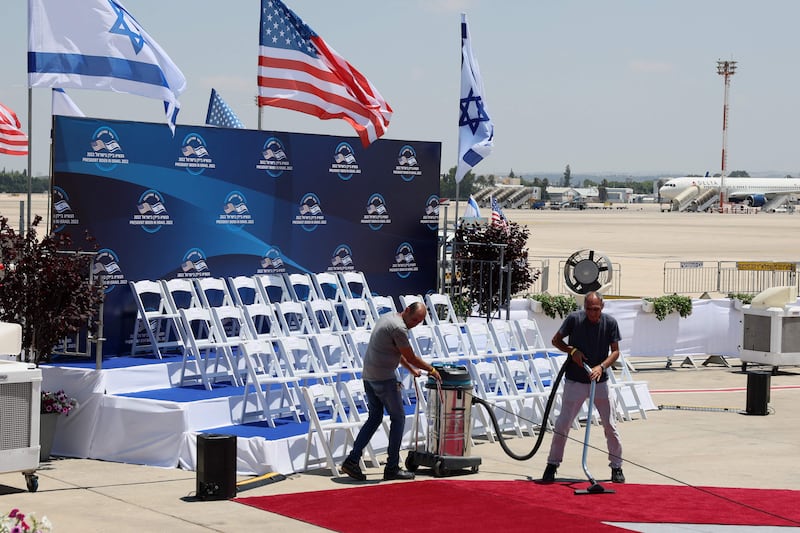 The red carpet at Ben Gurion Airport near Tel Aviv gets a spring-clean ahead of US President Joe Biden's arrival for an official visit. AFP
