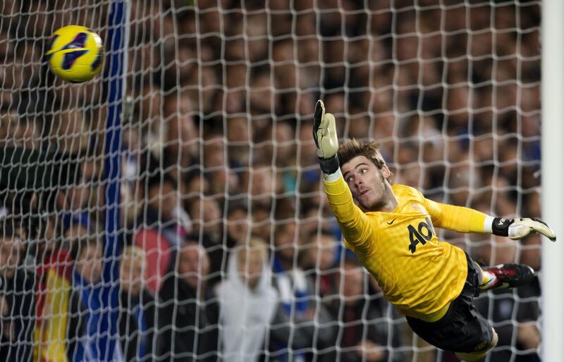 Manchester United's Spanish goalkeeper David de Gea fails to reach a goal-bound shot during the English Premier League football match between Chelsea and Manchester United at Stamford Bridge in London, on October 28, 2012. Manchester United won the game 3-2. AFP PHOTO/ADRIAN DENNIS

RESTRICTED TO EDITORIAL USE. No use with unauthorized audio, video, data, fixture lists, club/league logos or “live” services. Online in-match use limited to 45 images, no video emulation. No use in betting, games or single club/league/player publications.
 *** Local Caption ***  773534-01-08.jpg