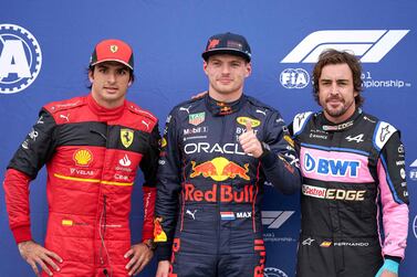 Red Bull Dutch driver Max Verstappen (C) gives the thumbs up as he poses with Ferrari's Monegasque driver Charles Leclerc (L) and Alpine’s Spanish driver Fernando Alonso following the qualifying session for the Canada Formula 1 Grand Prix on June 18, 2022, at Circuit Gilles-Villeneuve in Montreal.  (Photo by Geoff Robins  /  AFP)