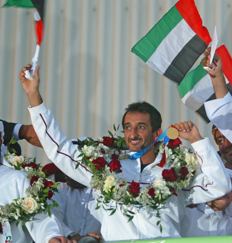 epa000261845 UAE's first Olympic gold medalists ever Sheikh Ahmed Mohammed Hasher al Maktoum, waves a local supporters at his arrival at Dubai  from Athens, Thursday 26 August 2004.
40 years old Ahmed won gold in the Double Trap shooting discipline.  EPA/Jorge Ferrari