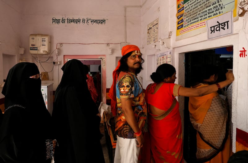 Voters queue in Varanasi, some of the 100 million Indian citizens expected to vote on the seventh day of polling in the general election. Reuters