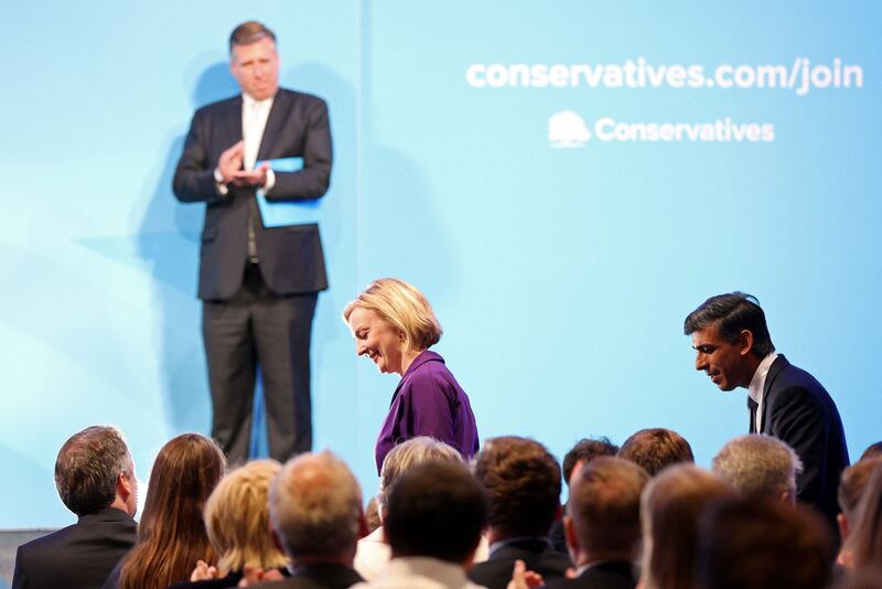 Liz Truss and Rishi Sunak arrive at an event to announce the winner of the UK's Conservative Party leadership contest, and Britain's next prime minister, in central London. AFP