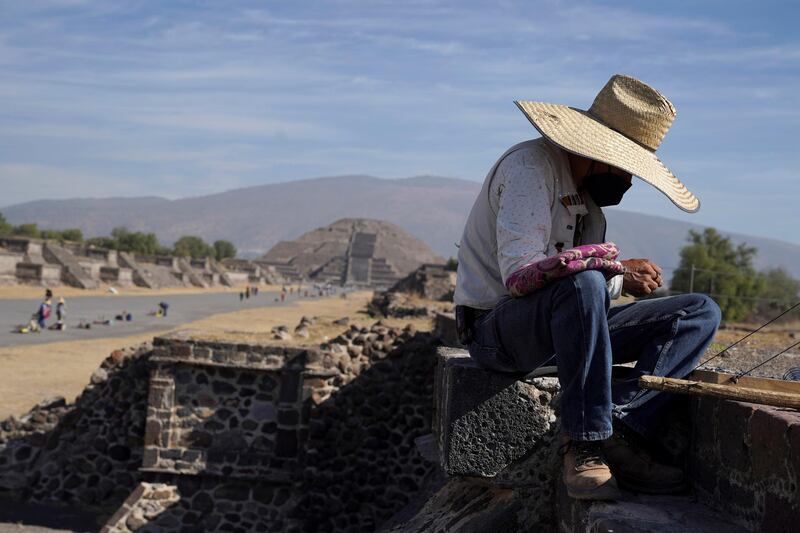 A vendor arranges his merchandise during the gradual reopening of the ancient Teotihuacan pyramids to the public in San Juan Teotihuacan, Mexico. Reuters