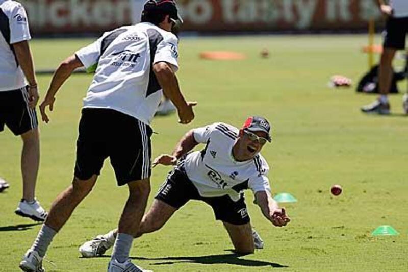 Andrew Strauss, right,the England captain, catches a ball during training at the Waca ground  in Perth, ahead of the third Ashes Test match against Australia, which starts tomorrow.