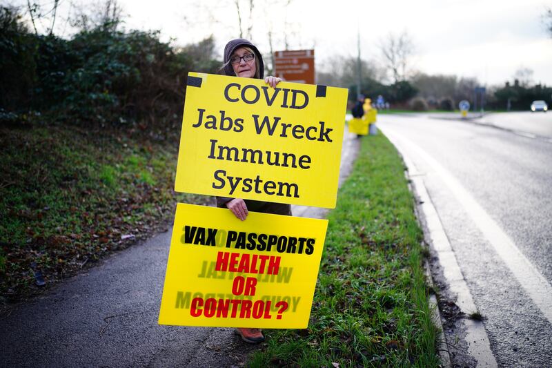 An anti-vaxxer on the side of the A39 carriageway in Glastonbury in Somerset. PA