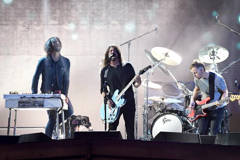 Dave Grohl, centre, front man of the Foo Fighters during their Brit's performance. Gareth Cattermole/Getty Images