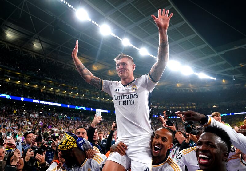 Toni Kroos is lifted on his Real Madrid teammates' shoulders after winning the Champions League in his last club game. PA