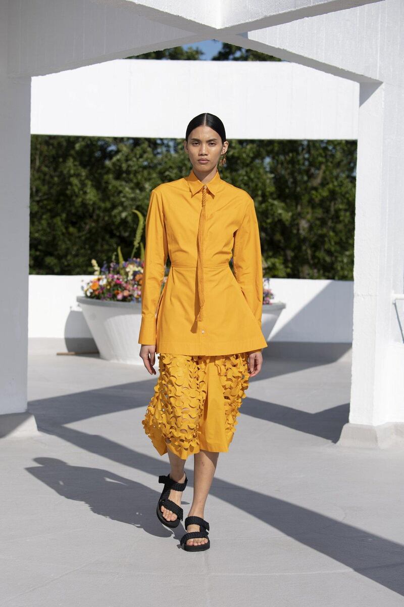 A jolt of marigold yellow, laser cut to resemble an army camouflage net, as part of Qasimi spring / summer 2022 collection. Courtesy Qasimi