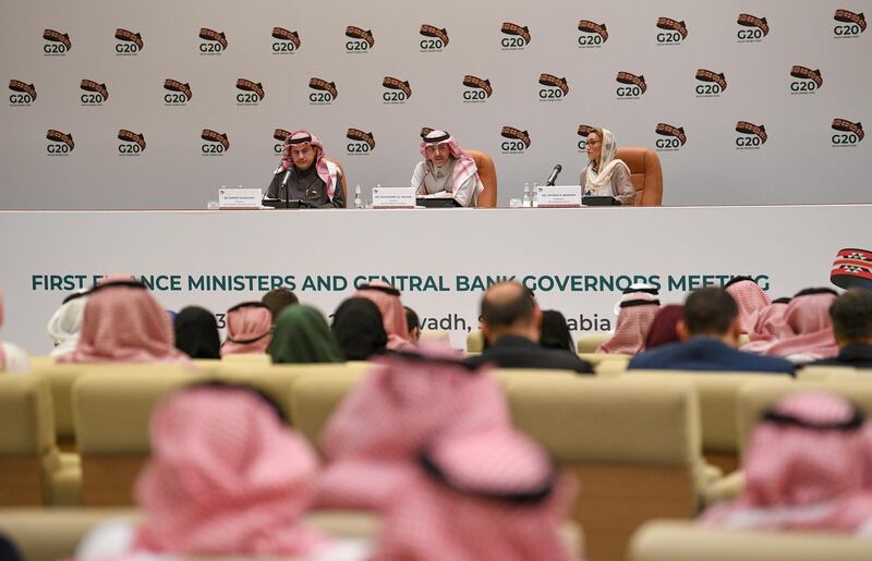 epa08241233 Saudi Arabia Minister of Finance Mohammed Al-Jadaan (C) and Saudi Arabia Monetary Authority Governor Ahmed Al Kholifey (L), hold a press conference at the end of G20 Finance Ministers and Central Bank Governors Meeting, Riyadh, Saudi Arabia, 23 February 2020. Finance ministers and central bank governors of the G20 are meeting in Riyadh on 22-23 February. Saudi Arabia will be hosting the 2020 G20 Leaders' Summit scheduled for 21-22 November.  EPA/Noufal Ibrahim