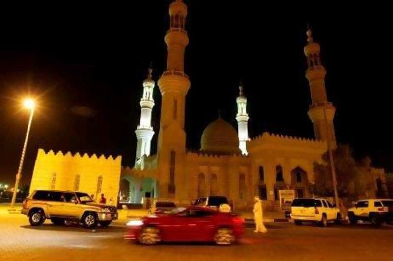 Young men gather in the parking lot of Sheikh Zayed Mosque at 3am in Ras Al Khaimah for illegal drag racing.