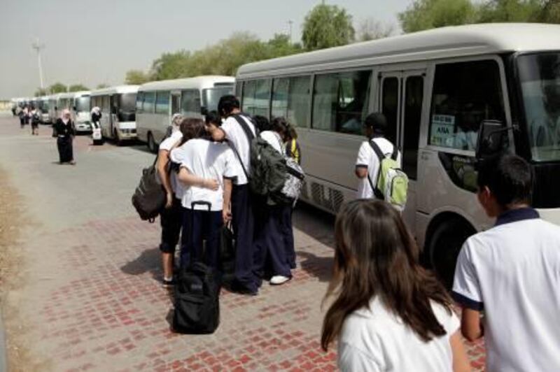 June 6, 2011 (Abu Dhabi) Students from The American International School get on bus to take them home after school ends. The American International School has put a request in to raise it's transport fees for next year June 6, 2011. (Sammy Dallal / The National)