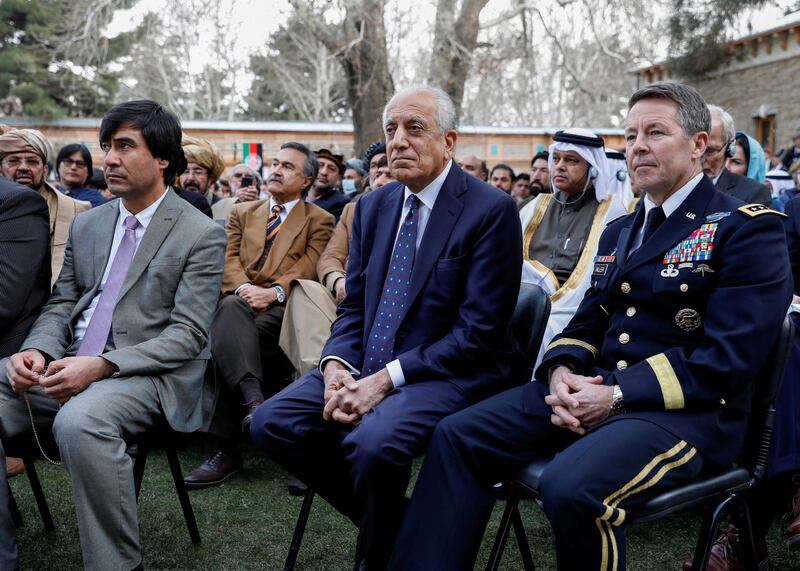 FILE PHOTO: U.S. envoy for peace in Afghanistan Zalmay Khalilzad (C) and U.S. Army General Scott Miller, commander of NATO's Resolute Support Mission and United States Forces ? Afghanistan, attend Afghanistan's President Ashraf Ghani's inauguration as president, in Kabul, Afghanistan March 9, 2020. REUTERS/Mohammad Ismail/File Photo