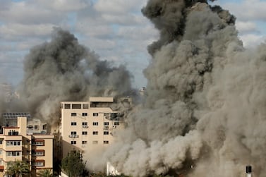 Smoke rises following an Israeli air strike on a building, during an escalation between Israel and Hamas, in Gaza City May 17, 2021. Reuters