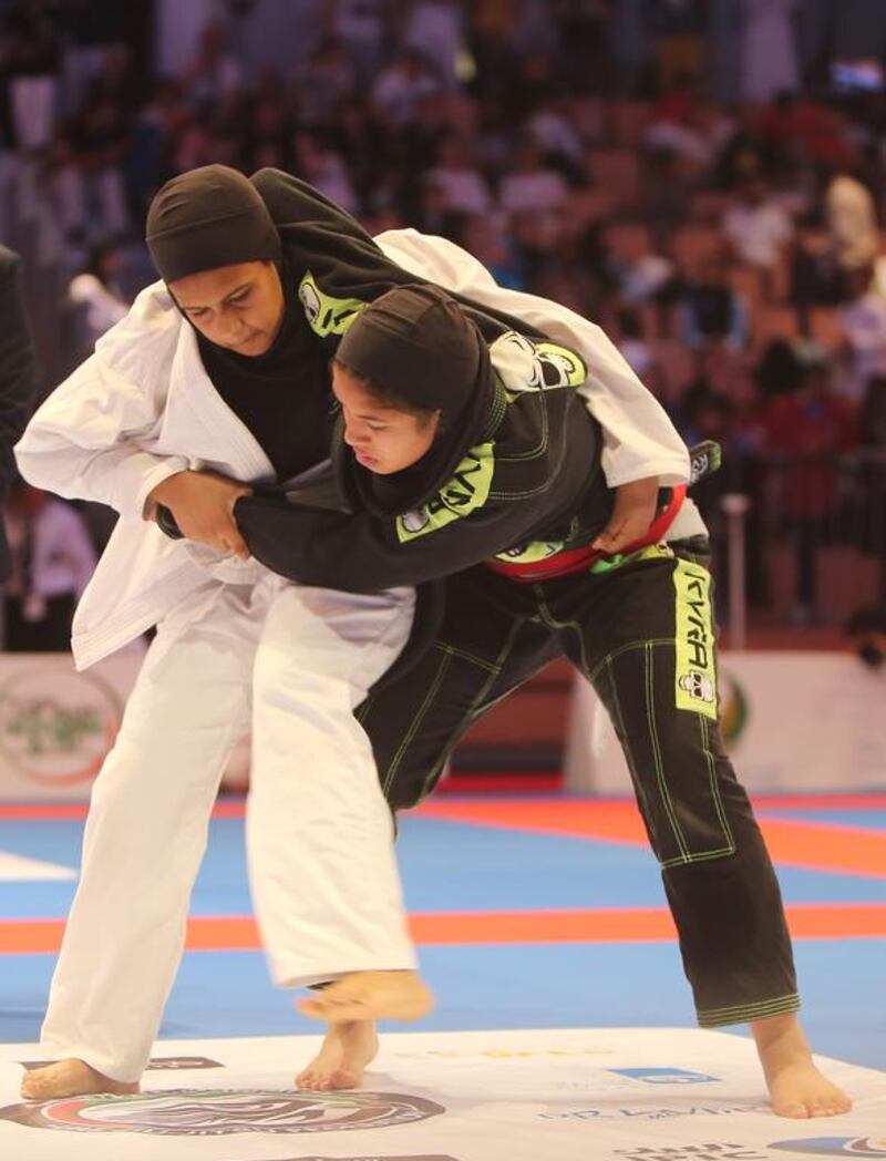 Alia Mohammed Salem, left, of the UAE shown in her match with Lolwa Al Shamsi of the UAE in the Abu Dhabi World Youth Jiu-Jitsu Championship 2016. Ravindranath / The National