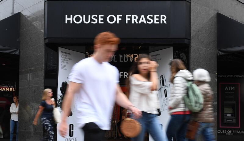 epa06940507 Pedestrians pass a House of Fraser store in London, Britain, 10 August 2018. According to media reports Sports Direct boss Mike Ashley has agreed the purchase of House of Fraser department store chain after the store was close falling into administration.  EPA/ANDY RAIN