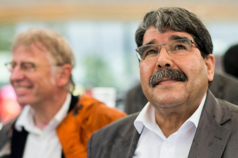 epa06565008 (FILE) - Salih Muslim (R), co-chairman of the Democratic Union Party (PYD) is welcomed during a Labor Day demonstration in Zurich, Switzerland, 01 May 2015, (reissued 25 February 2018). According to Turkish media, a prominent Syrian-Kurdish leader Salih Muslim, (Saleh Muslim) the former co-chair of the Democratic Union Party (PYD), was spotted in Marriott Hotel where he held two meetings. He was arrested by Czech police upon Turkey's request late on February 24 in the Czech capital, according to a statement by a coalition of political parties that includes the PYD.  EPA/ENNIO LEANZA *** Local Caption *** 51912557