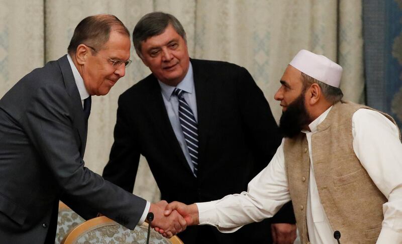 Mr Lavrov welcomes a member of the Taliban delegation, Alhaj Mohammad Sohail Shaina. Reuters