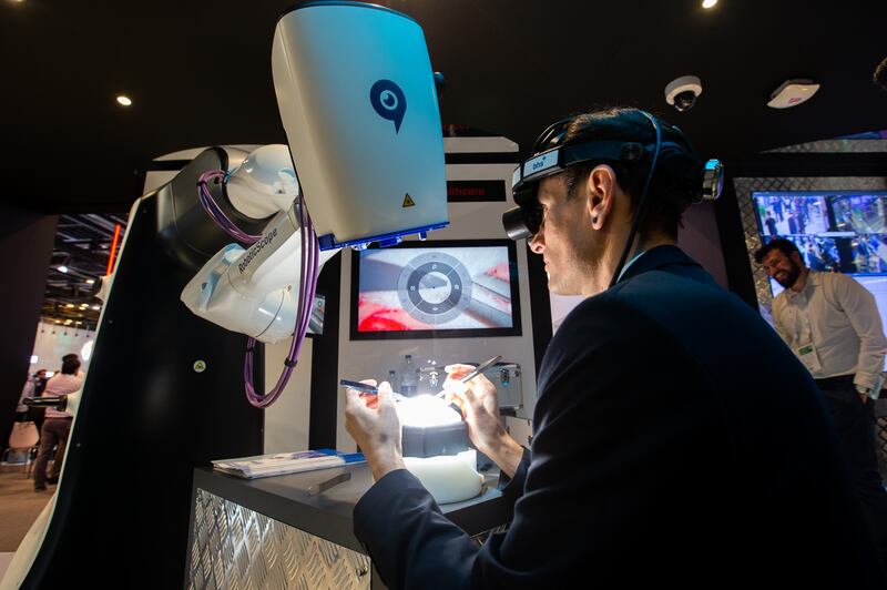 BHS Technologies' robot is a specially developed head-mounted display. It allows surgeons to interact with a robot arm that carries a microscope, to allow more precision and speed during complex surgery.