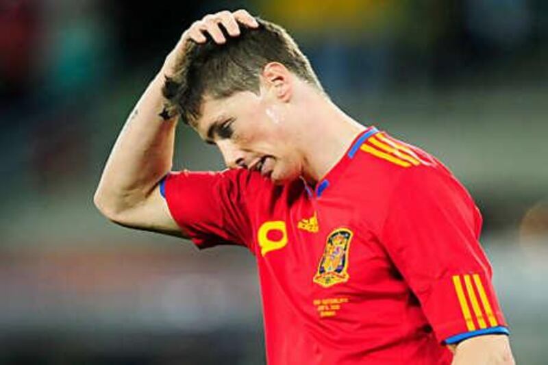 The striker Fernando Torres looks dejected during the unexpected Spanish defeat to Switzerland.