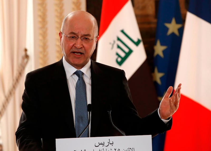 Iraqi President Barham Saleh gestures as he addresses a press conference alongside the French President at The Elysee Palace in Paris on February 25, 2019.  Saleh is on a two-day visit to France with a focus on the country's security and the fight against the Islamic State group in the region.  / AFP / POOL / Christophe Ena
