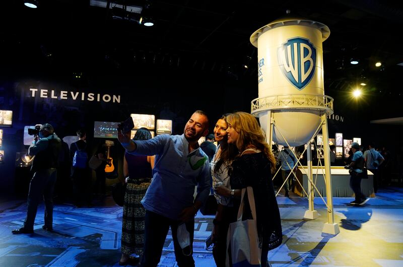 Visitors shoot a selfie inside the Storytelling Showcase at the Warner Bros Studio Tour Hollywood media preview on June 24, 2021, in Burbank, California.