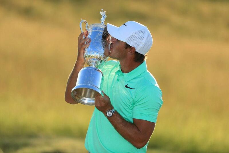 Brooks Koepka of the United States poses with the winner’s trophy after his victory at the 2017 US Open at Erin Hills on Sunday. AFP