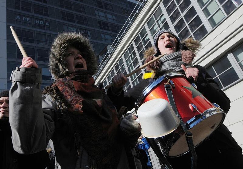 Russian anti-fascist activists protest near the venue of the International Russian Conservative Forum in St Petersburg, March 2015. About 150 representatives of Russian nationalist and right-wing European parties met to berate the West for its stance on the Ukraine conflict and sanctions against Russia. Aleksander Koryakov / Kommersant Photo via Getty Images