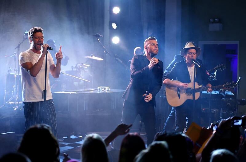 Howard Donald, Gary Barlow and Mark Owen of Take That. Tim P Whitby / Getty Images