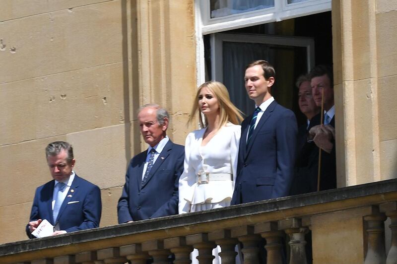 Ivanka Trump (C) and her husband Senior Advisor to the President of the United States Jared Kushner (R) watch from a balcony as the US President Donald Trump and US First Lady Melania Trump arrive for a welcome ceremony at Buckingham Palace. AFP