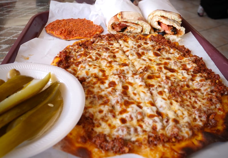 Flatbread with sujuk and cheese from Forn Al Hara. Photo: Steve LaBate