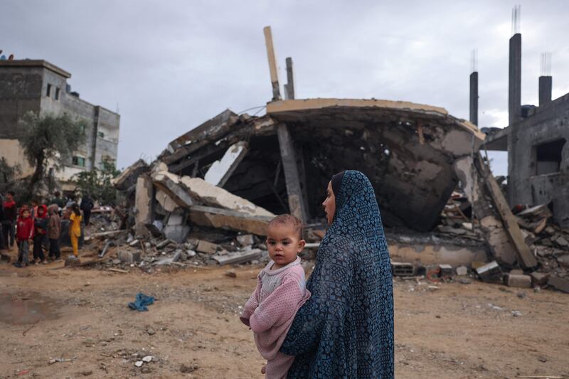 Palestinians inspect the destruction after overnight Israeli strikes on Rafah. AFP